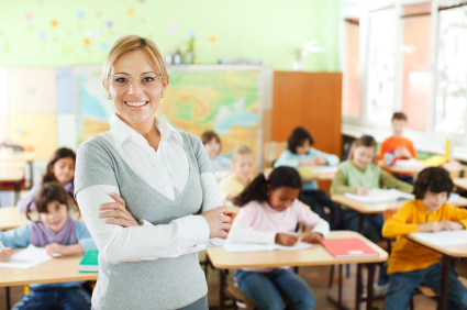 Smiling teacher at the school class.
